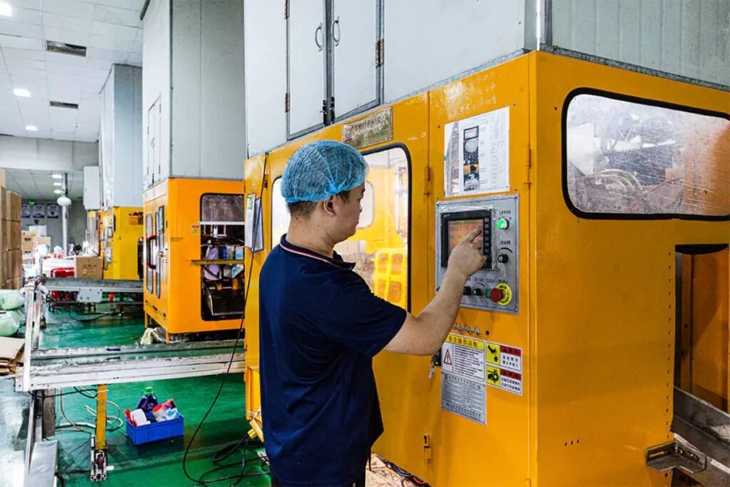 Operator Adjusting Blow Molding Machine Parameters